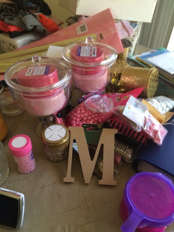 jars, candy, sprinkles, tissue paper, and the "M"